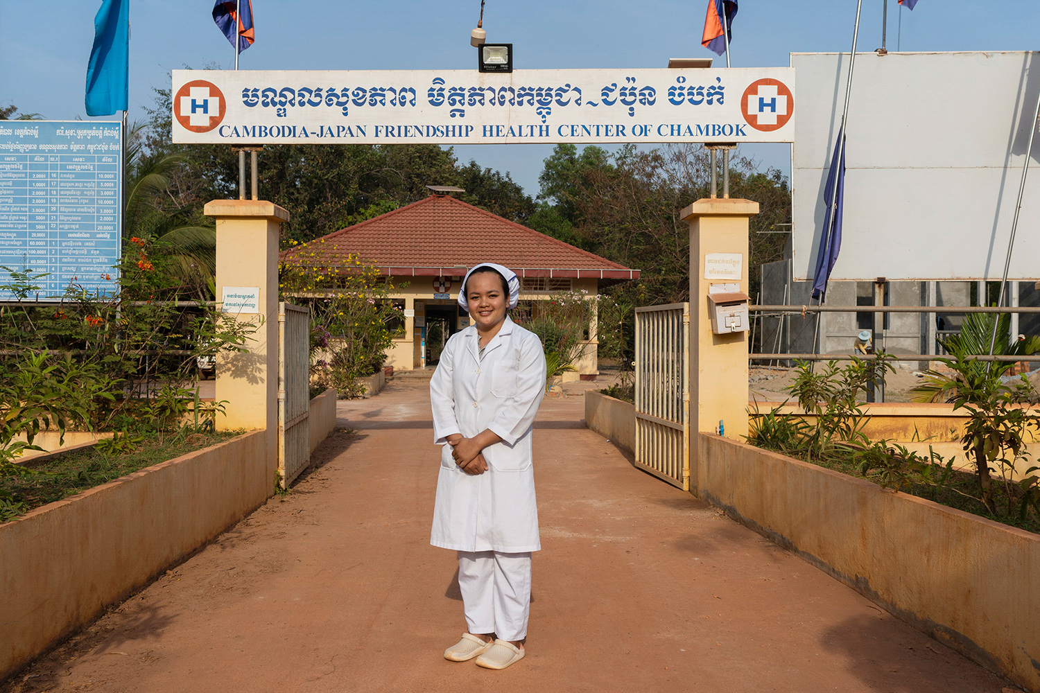 Health worker poses outside a Health Center in Cambodia