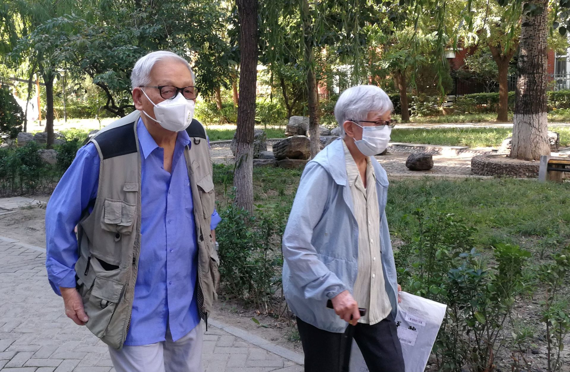 Older adult couple out for a walk in Beijing, China.